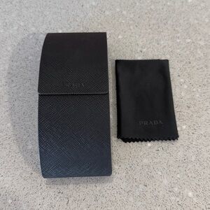 Prada  Black sunglasses Case with cleaning cloth.